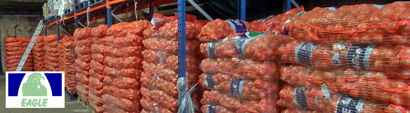 picture of warehouse at Wades And Ellie showing stock of Eagle onions with the Eagle onions logo on the bottom left hand side